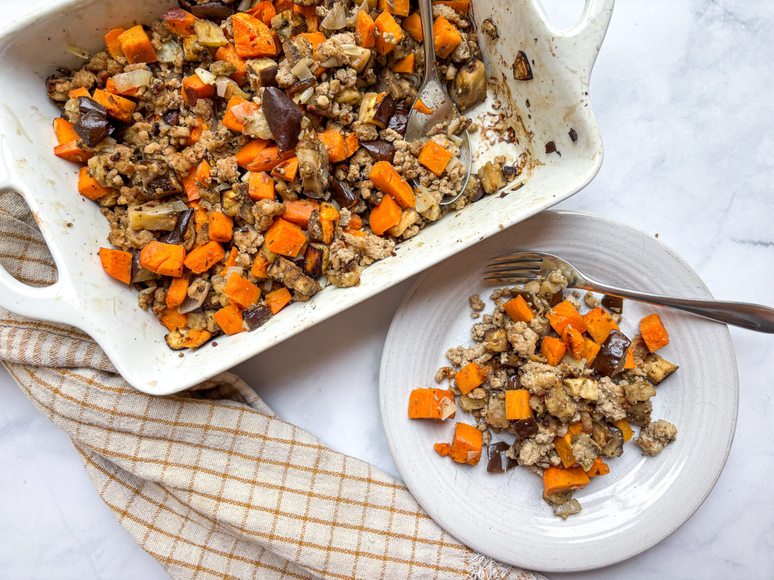 Eggplant casserole finished with a single plate and dish.
