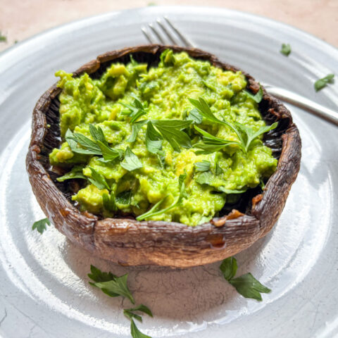 Grilled portobello mushrooms finished and plated.