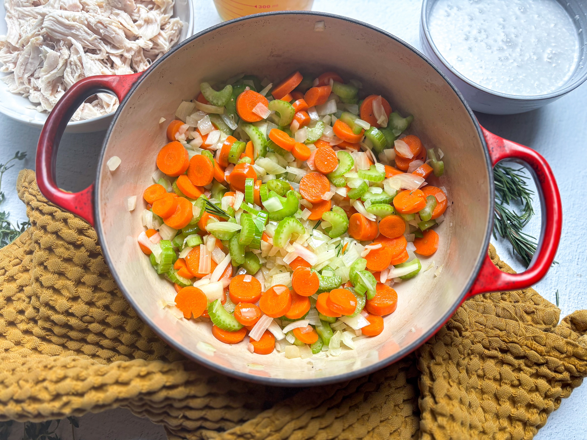 Chicken pot pie soup preparation in a pot. 