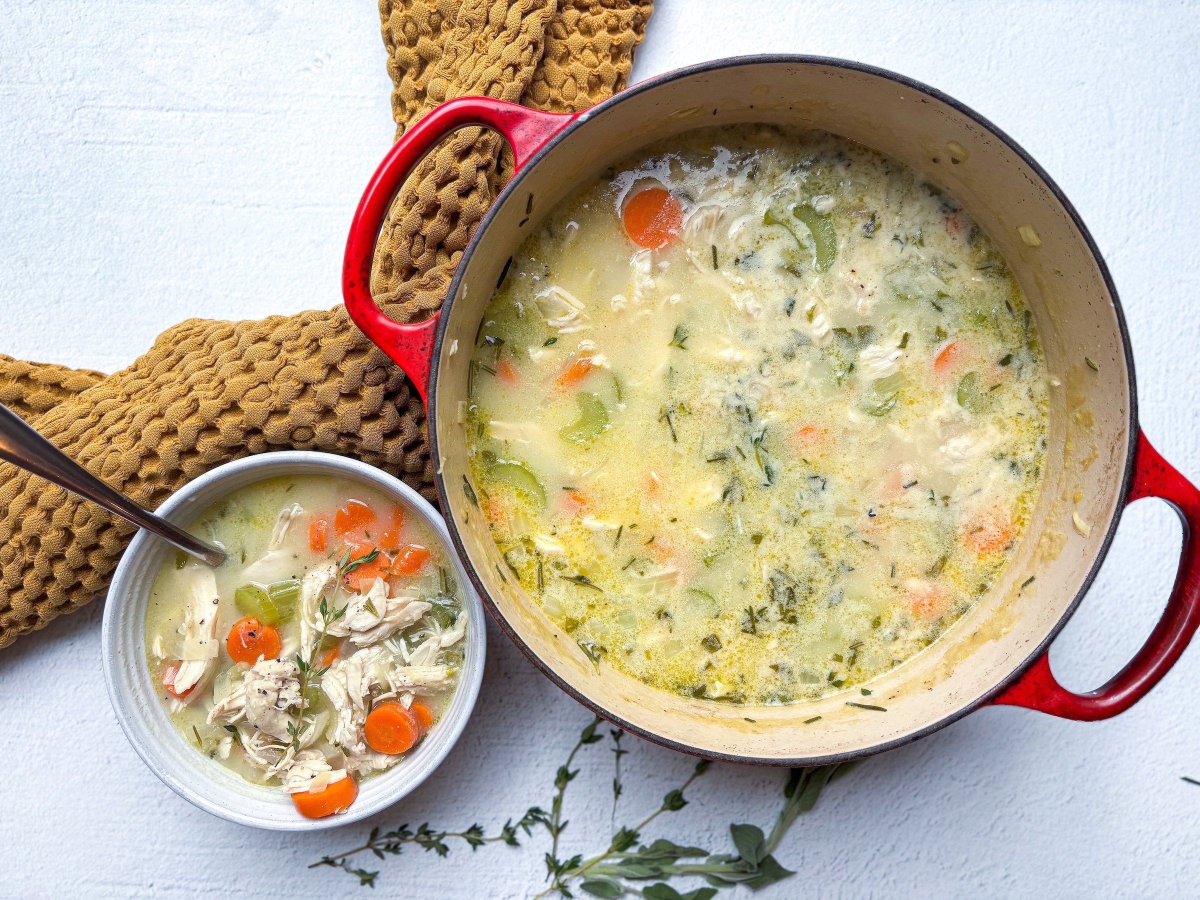 Chicken pot pie soup finished, with a bowl on the side. 