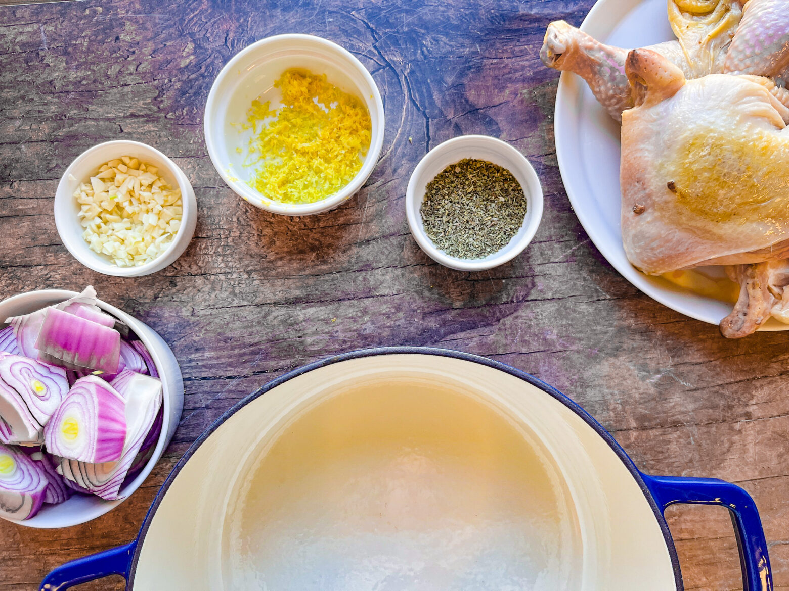 Spring chicken skillet prepping ingredients dutch oven.