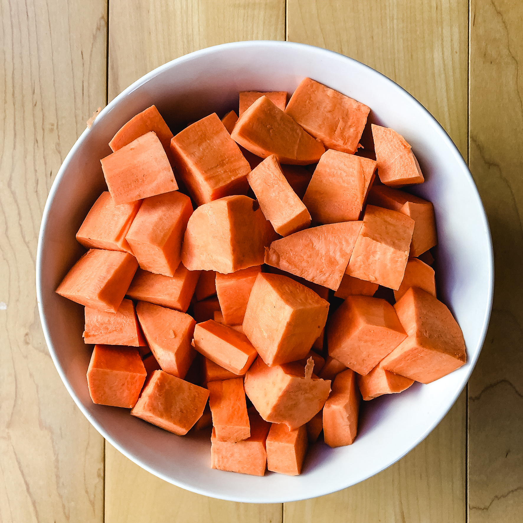 Sweet potatoes cubed in a bowl. 