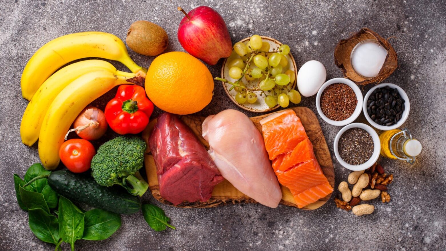 A selection of meats, vegetables, fruits, nuts, seeds and oil.