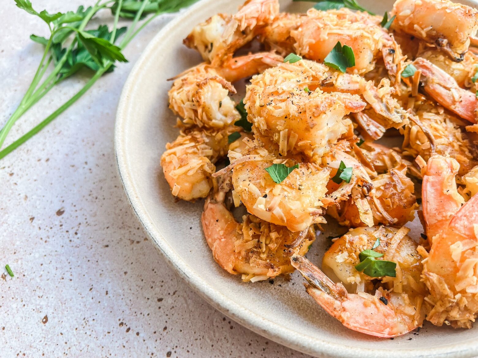 Coconut shrimp final photo plated with cilantro.