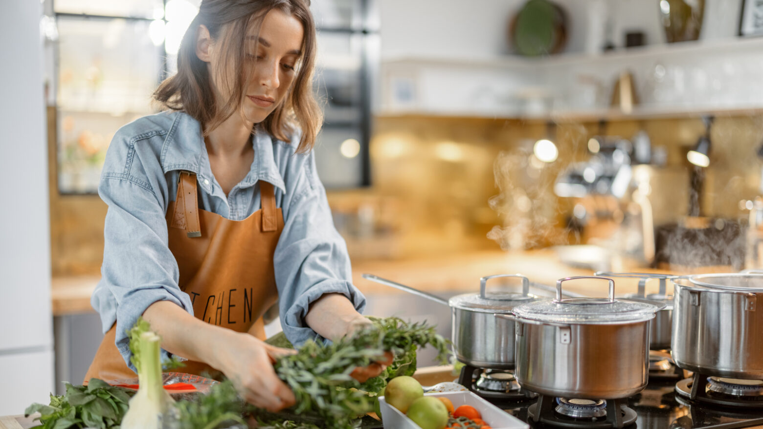 A woman preps a vegetarian meal in the kitchen