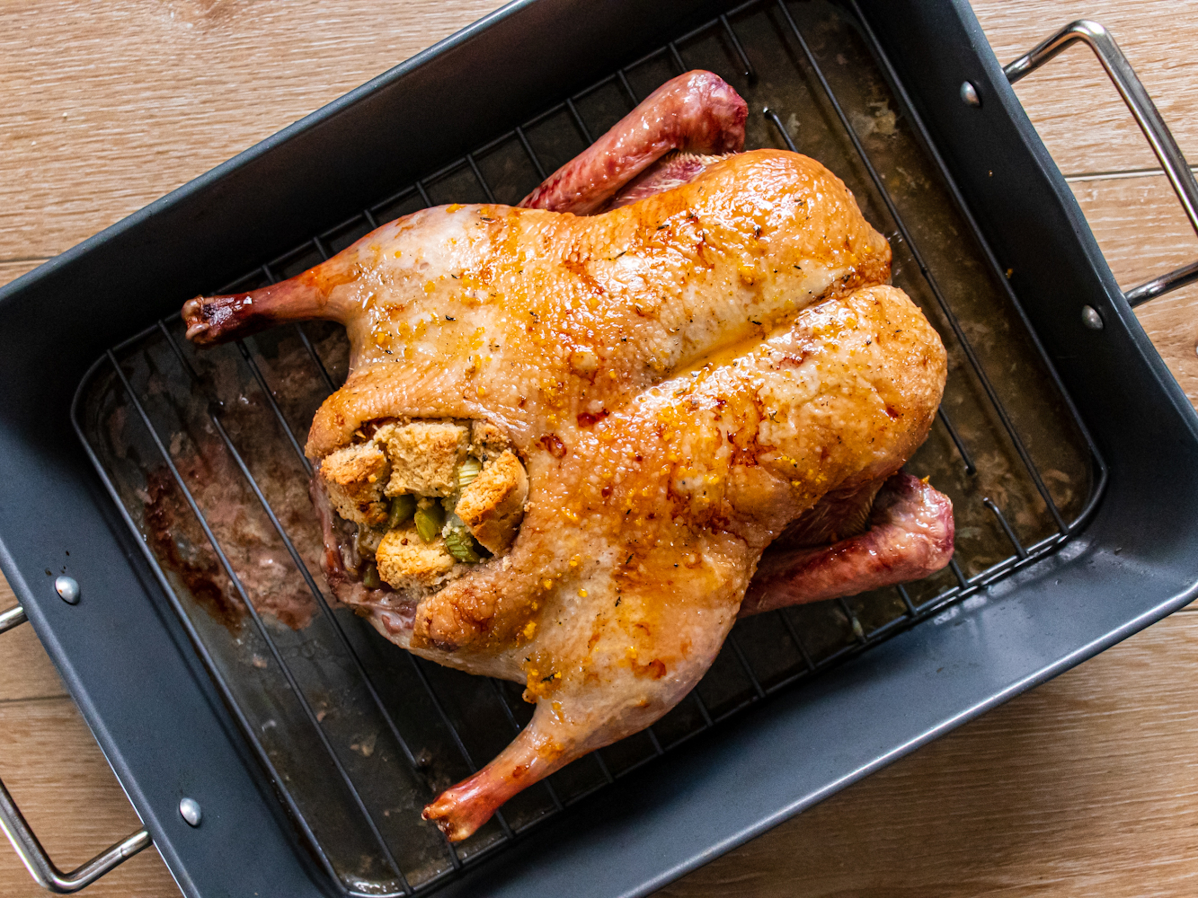 Cooked Orange Glazed Duck with Herb Stuffing in a pan