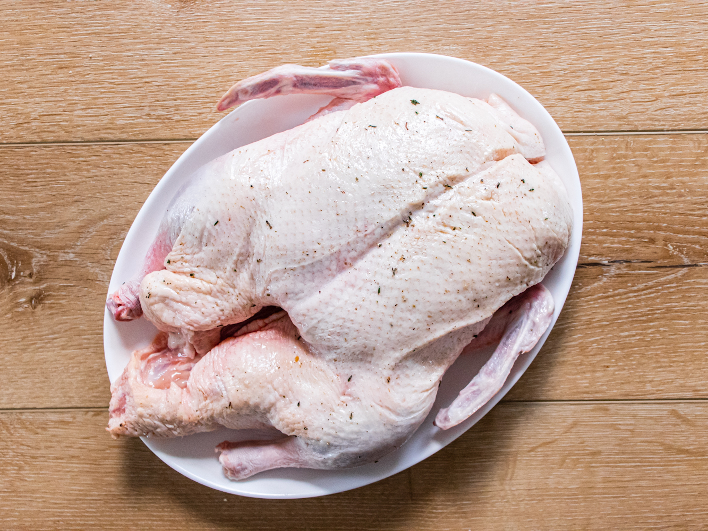 Raw duck with seasoning ready to be cooked