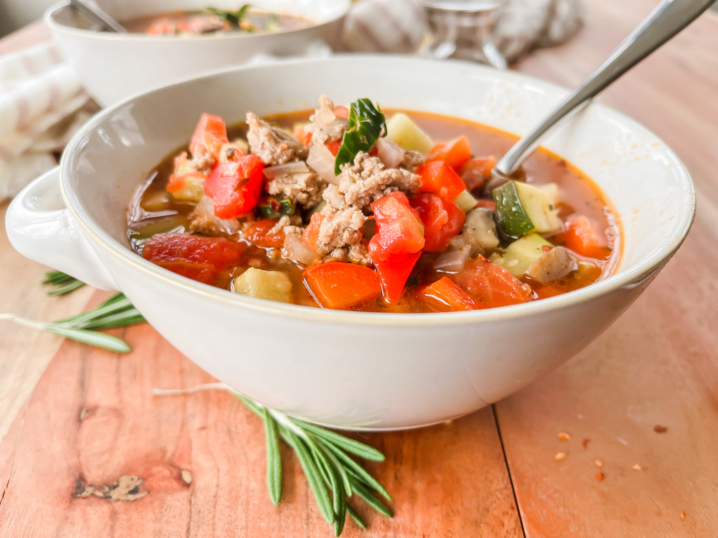 Paleo Turkey Minestrone Soup in a bowl, closeup