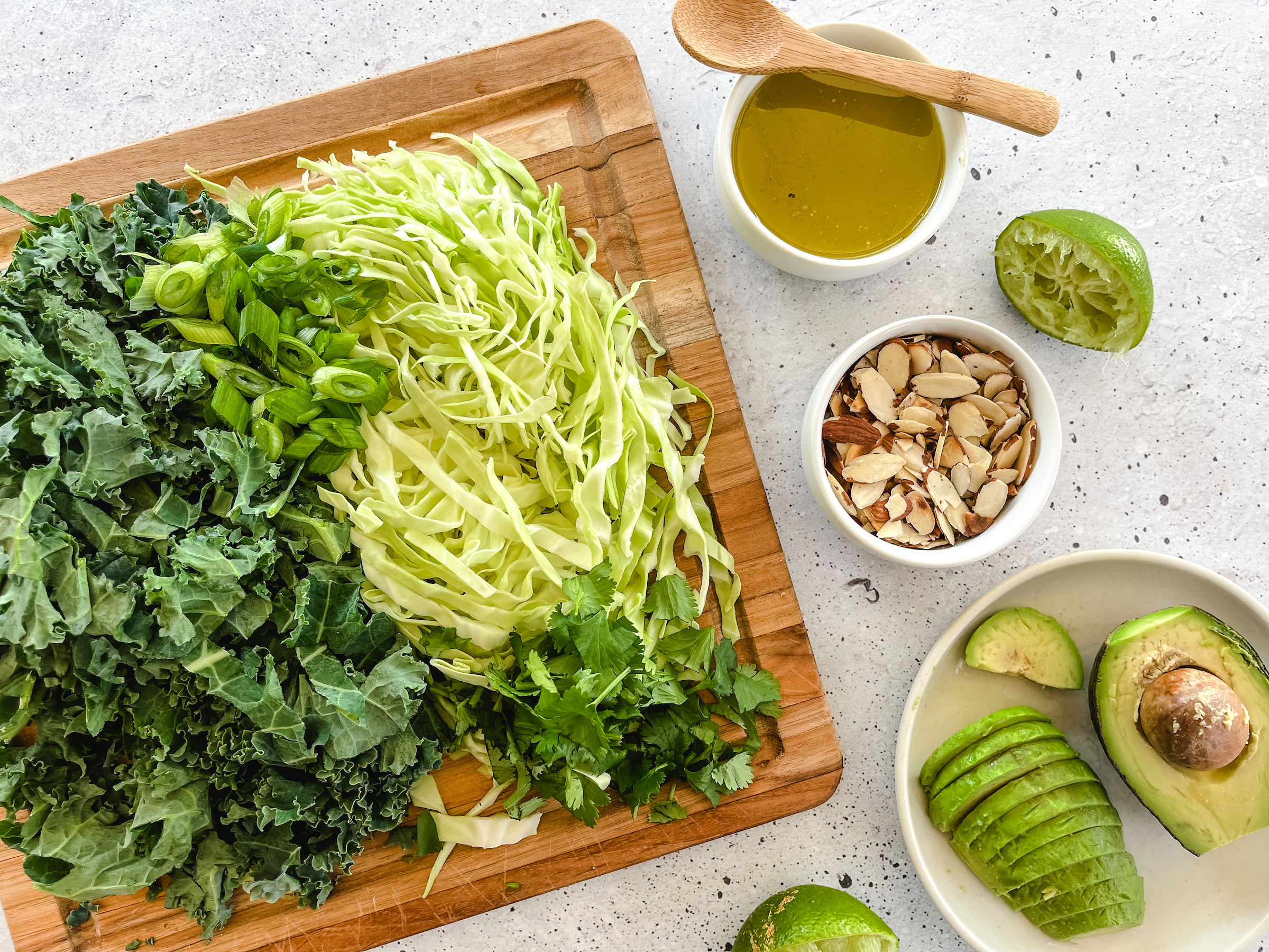 Almond Lime Kale Salad ingredients on the cutting board