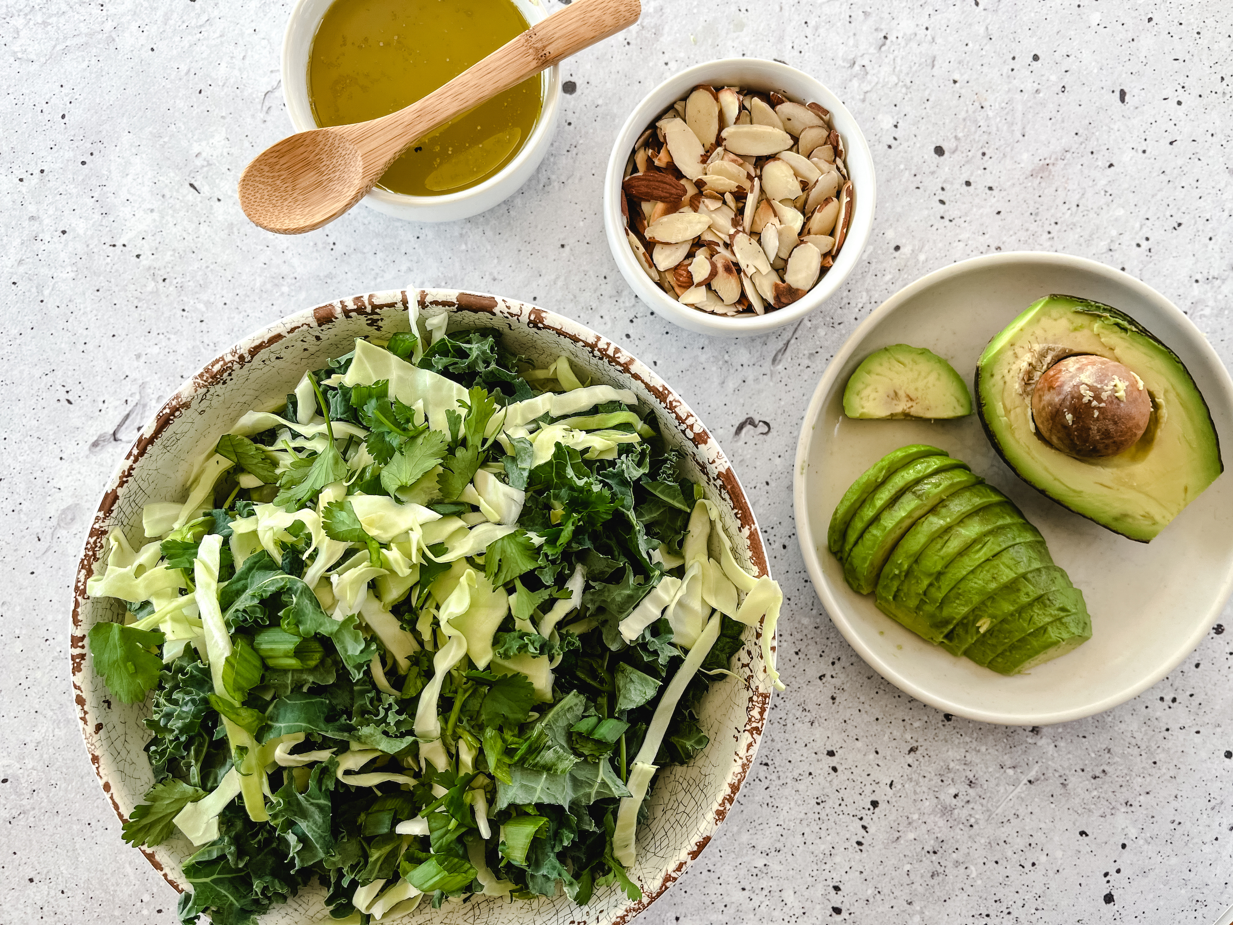 Almond Lime Kale Salad ingredients with the chopped kale