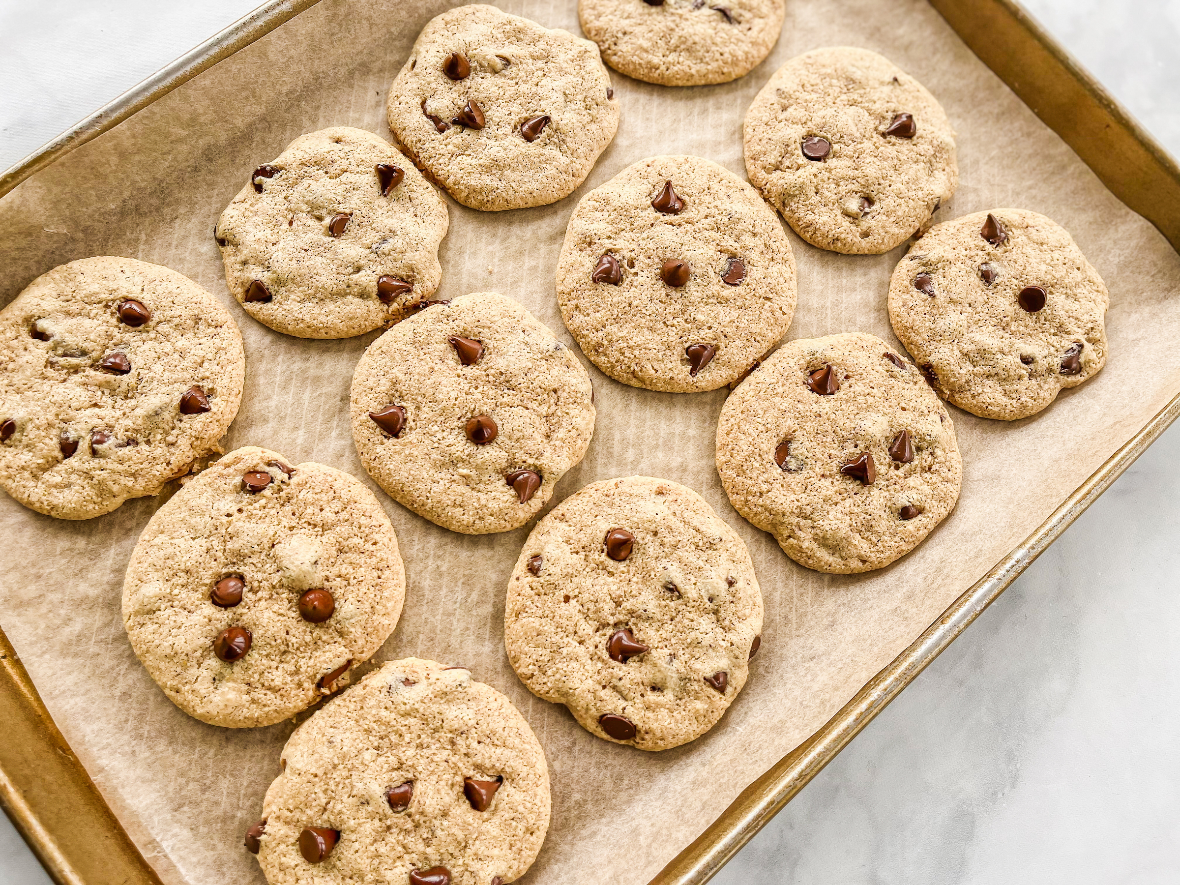 PaleoFLEX Chocolate Chip Cookies after being baked on a pan