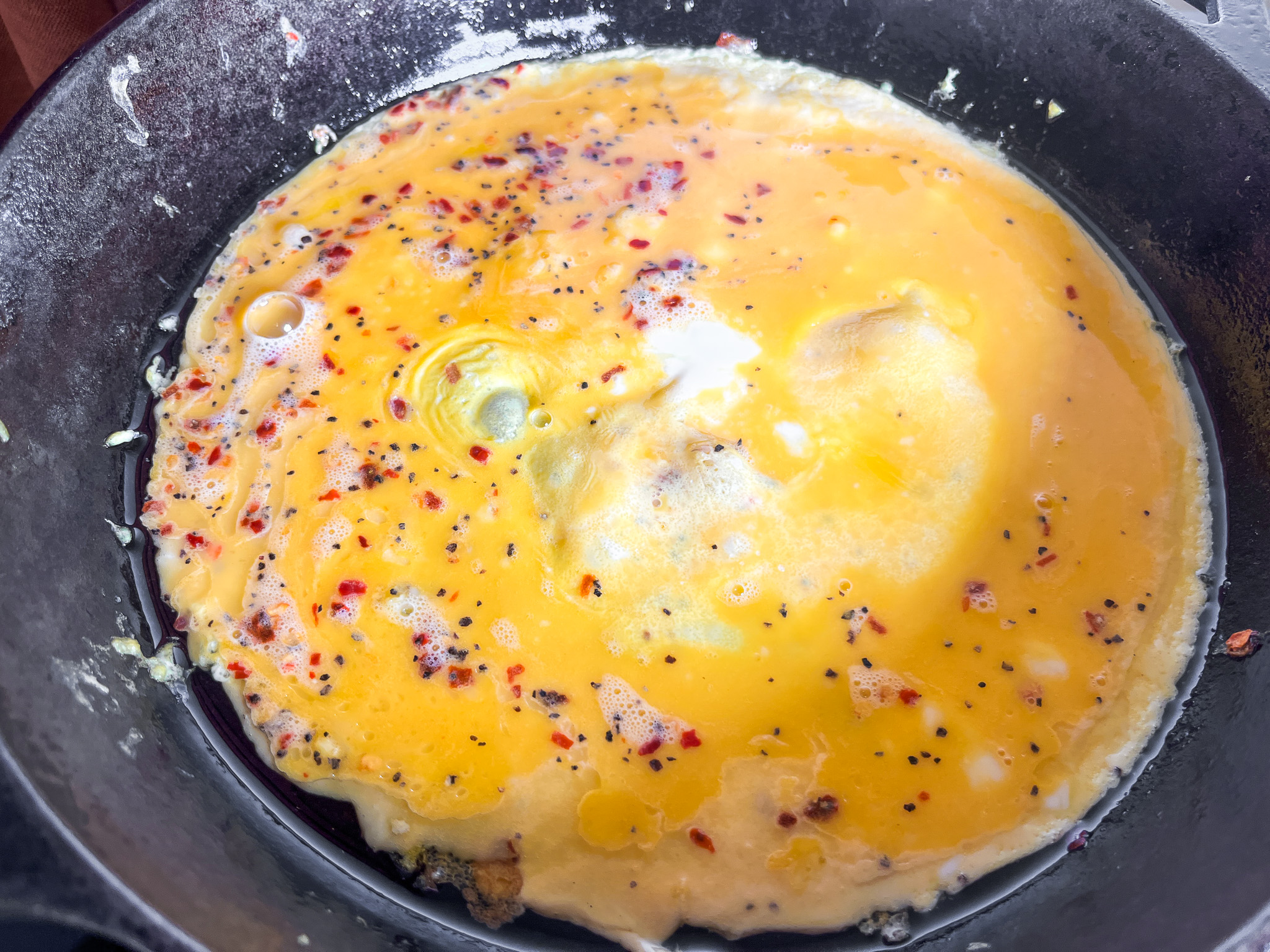 Egg wraps in a cast iron, cooking. 