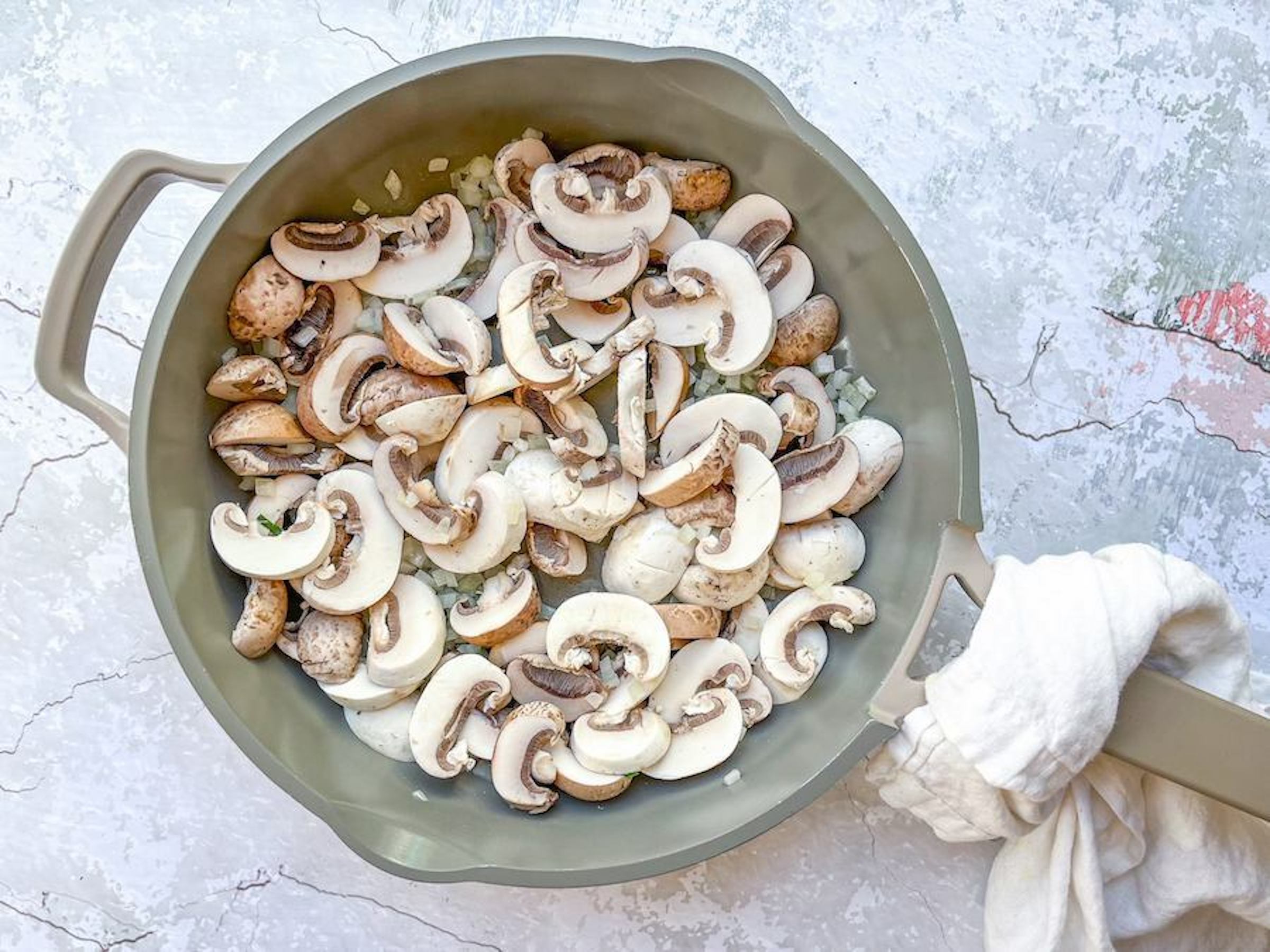 Mushrooms in a pan, ready to be cooked