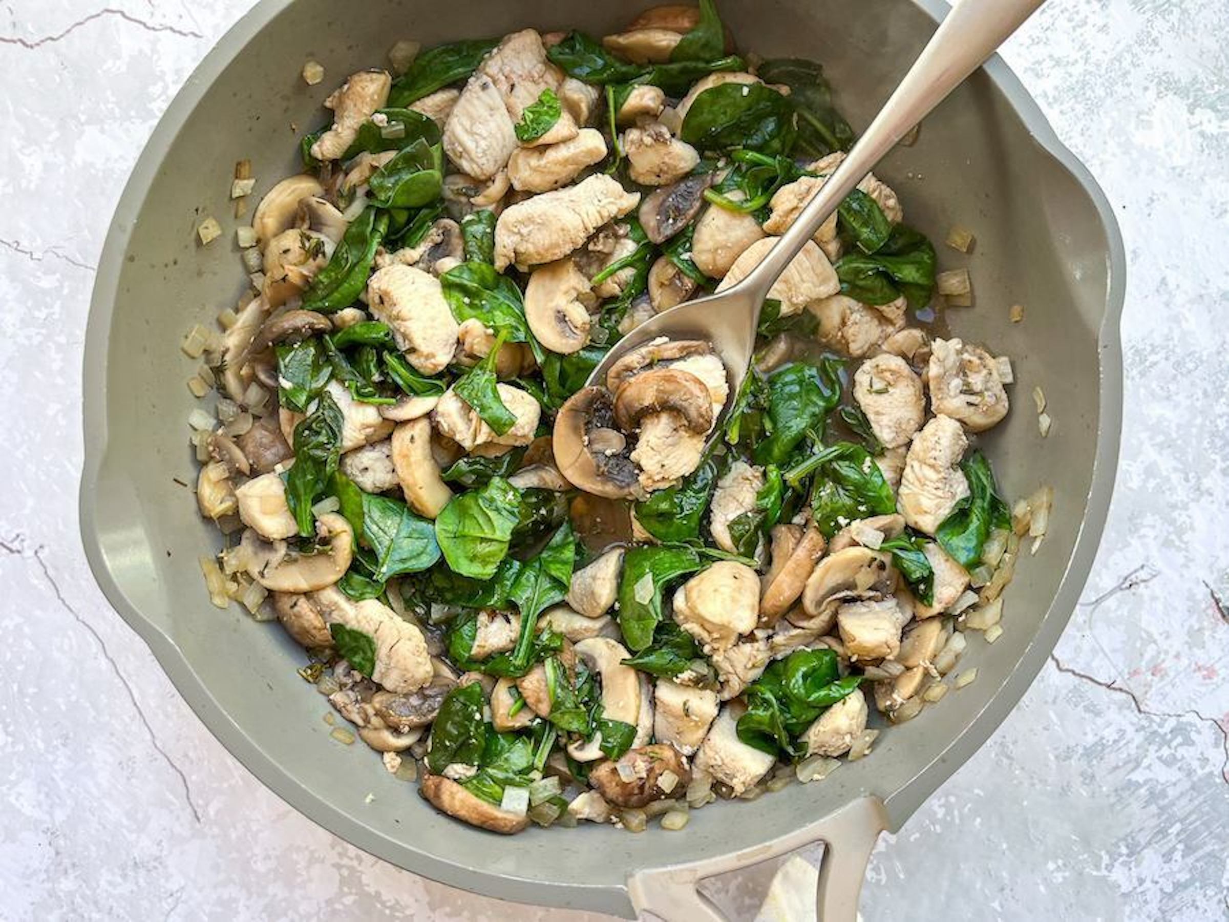 One-Skillet Chicken with Spinach and Mushrooms final product in a pan