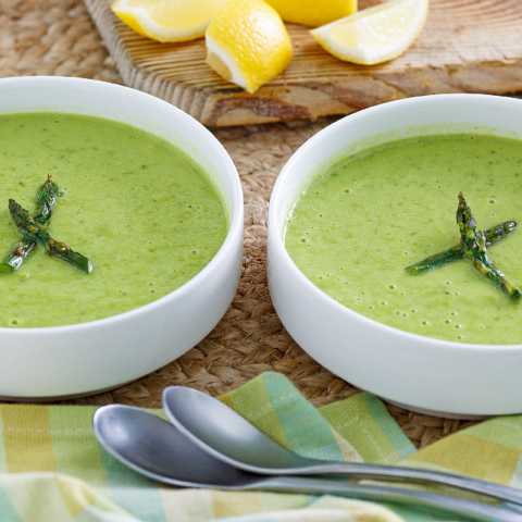 Avocado asparagus soup divided between two bowls