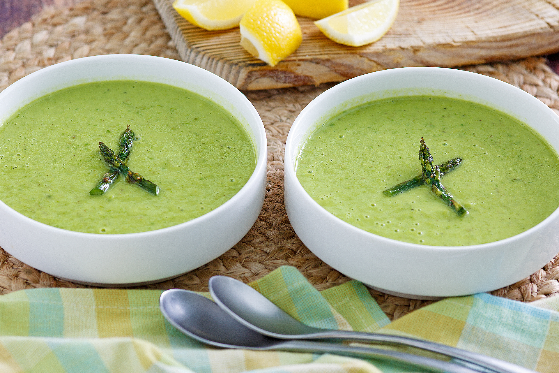 Avocado asparagus soup divided between two bowls