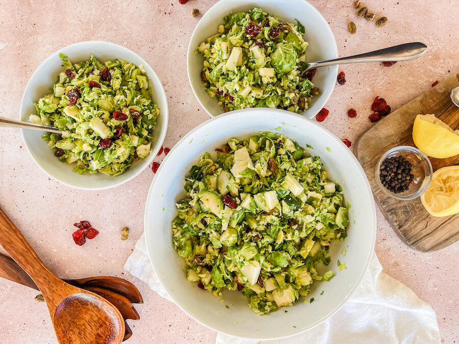 Finished Brussels Sprouts Salad with serving bowls.
