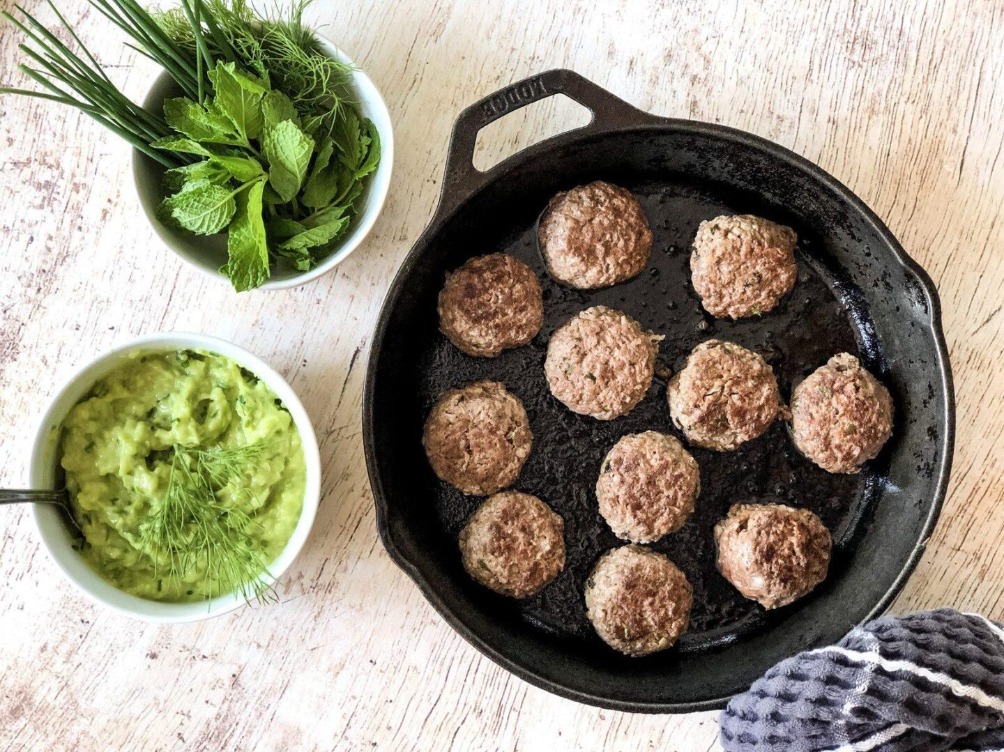 Lamb keftedes in a cast-iron pan