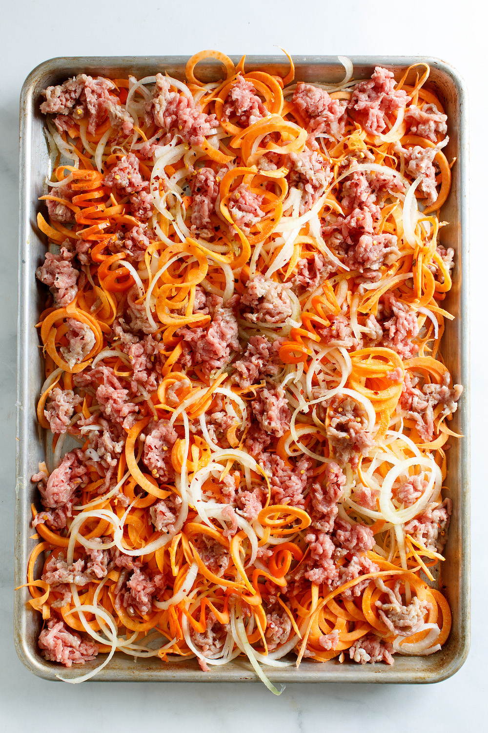 Sheet pan pork and vegetables on a pan