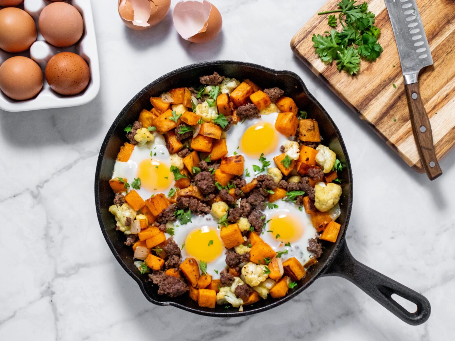 Above shot of sweet potato and bison hash in a skillet