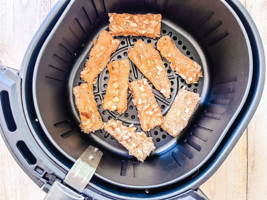 air fryer fish sticks being baked