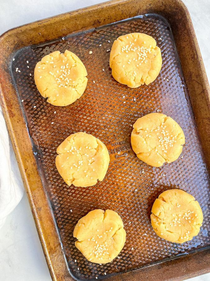 biscuits lined on a baking sheet