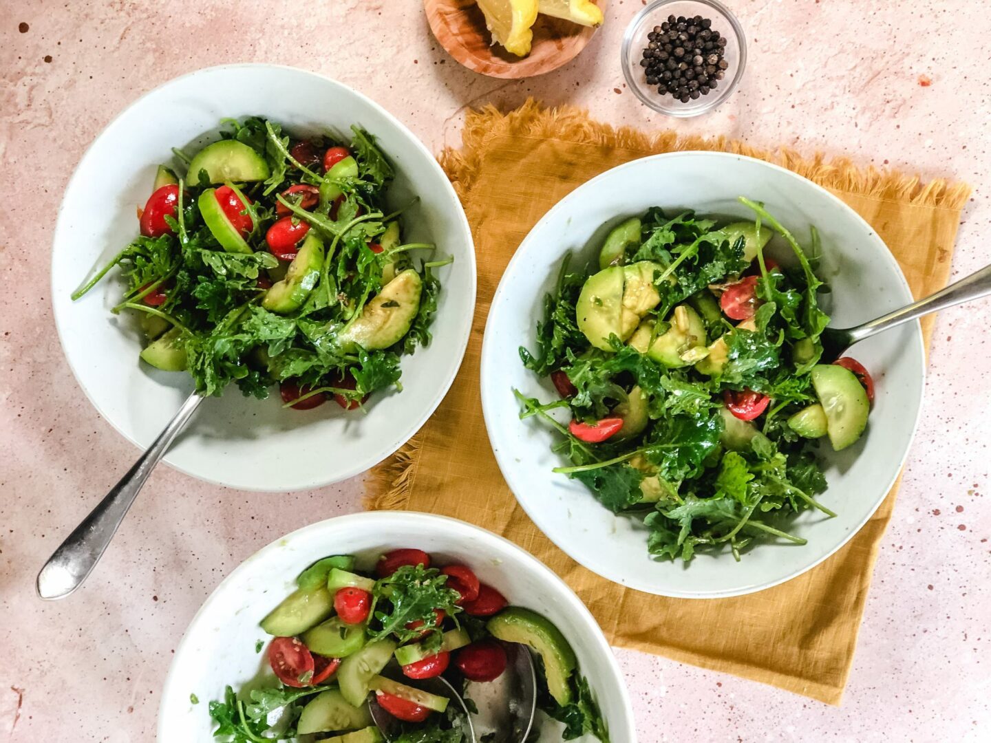 Cucumber tomato salad divided into bowls