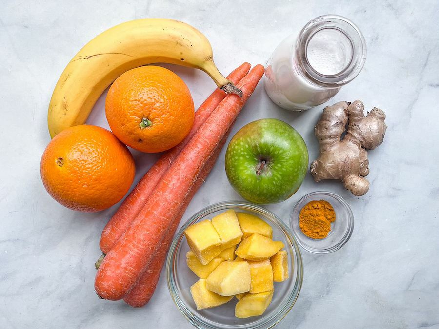 Ingredients for Mango Smoothie on a marbled surface