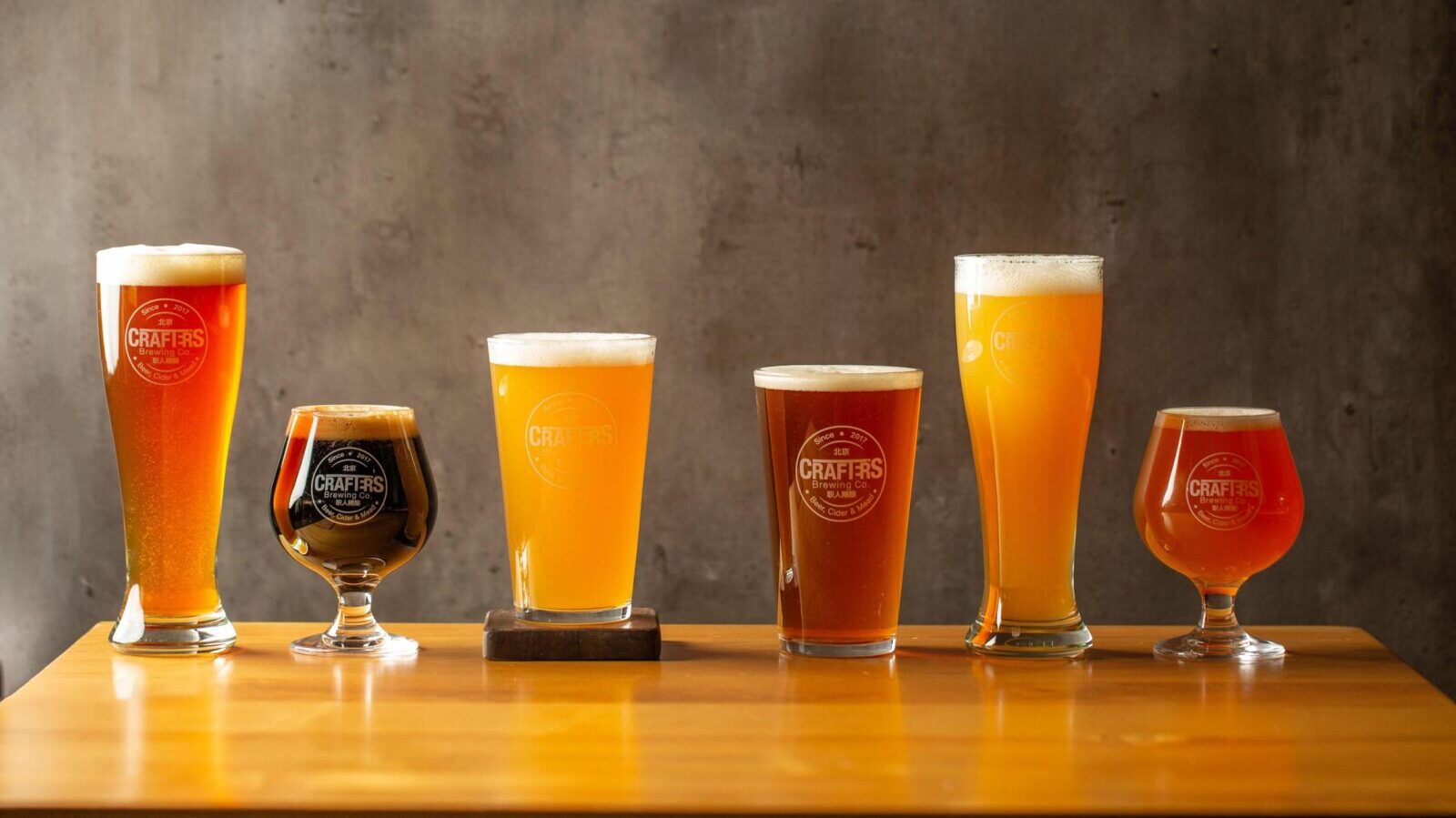 Six different beers in a variety of glasses.