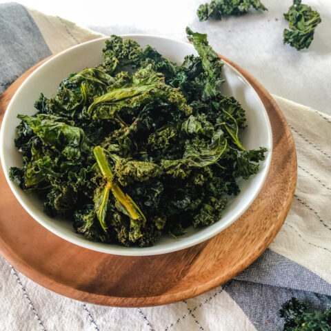 Easy Kale Chips recipe: Baked Kale Chips in a bowl on a table