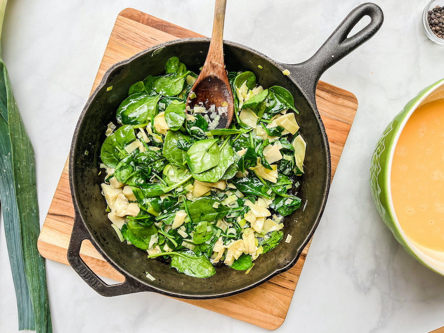 Artichoke and spinach frittata with sautéed produce.