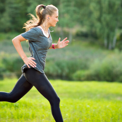 A woman sprinting outside
