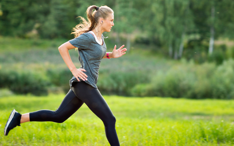 A woman sprinting outside