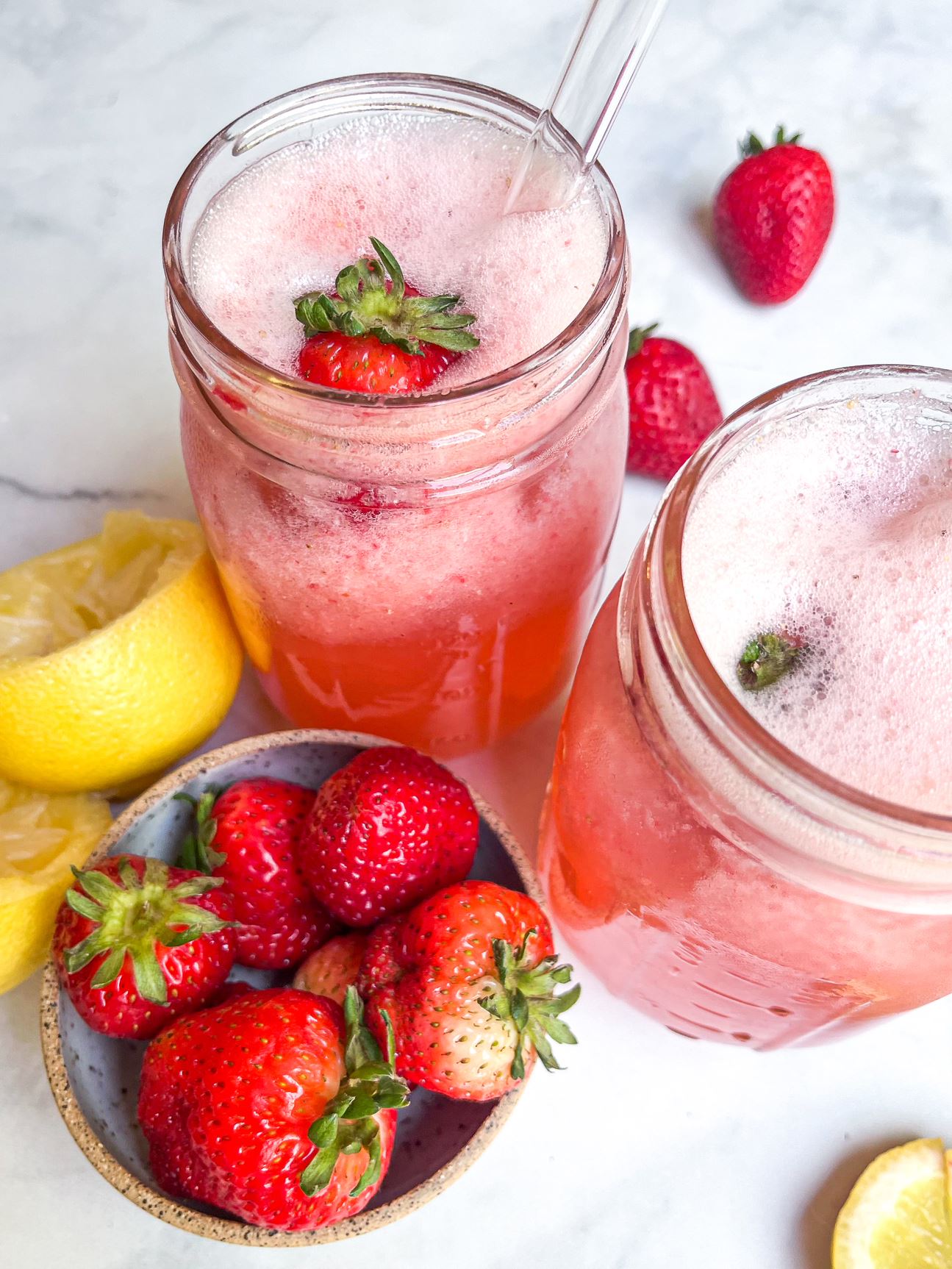 Finished strawberry-lemonade electrolyte drink in 2 glasses