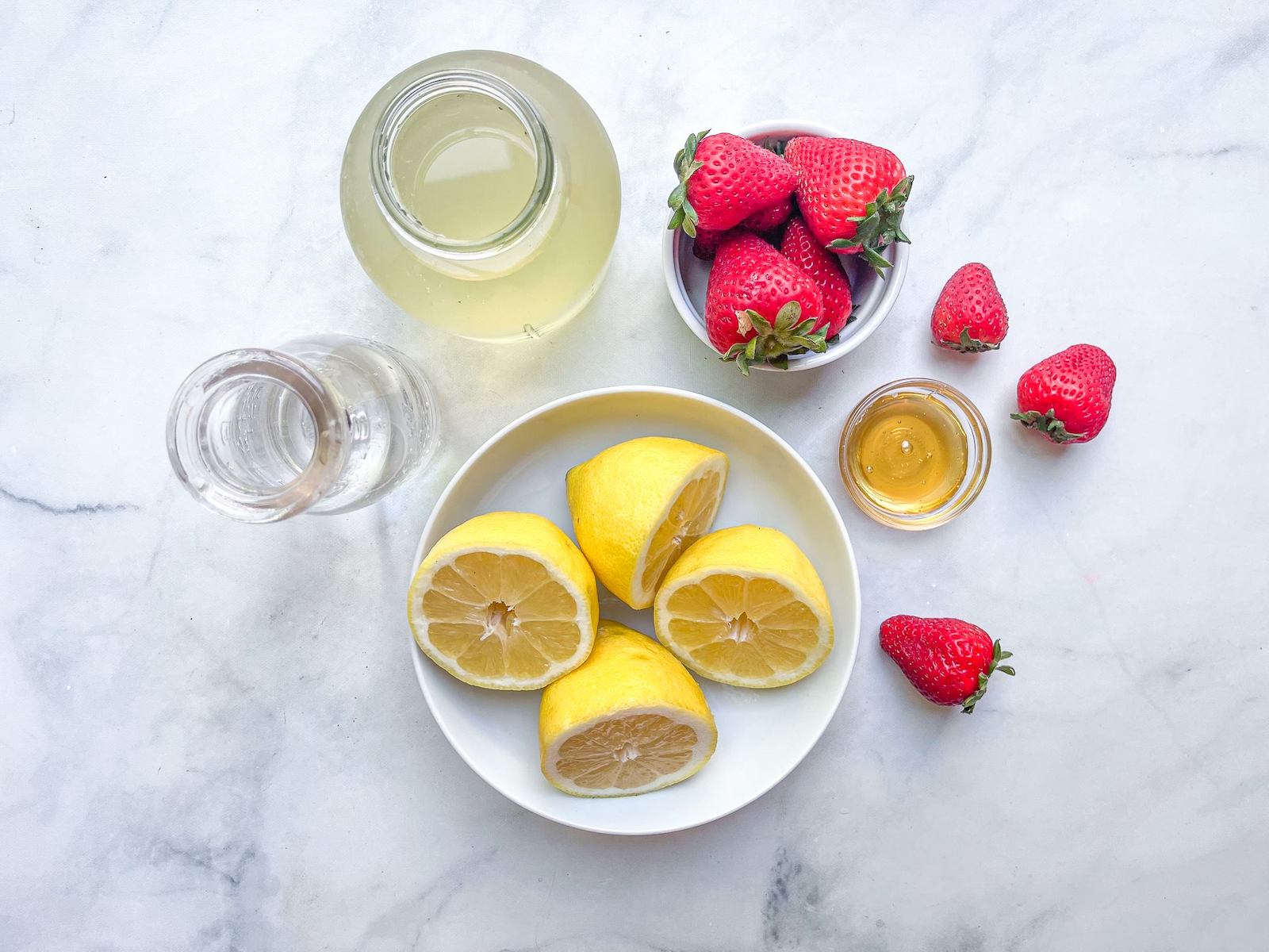 Ingredients for strawberry-lemonade electrolyte drink