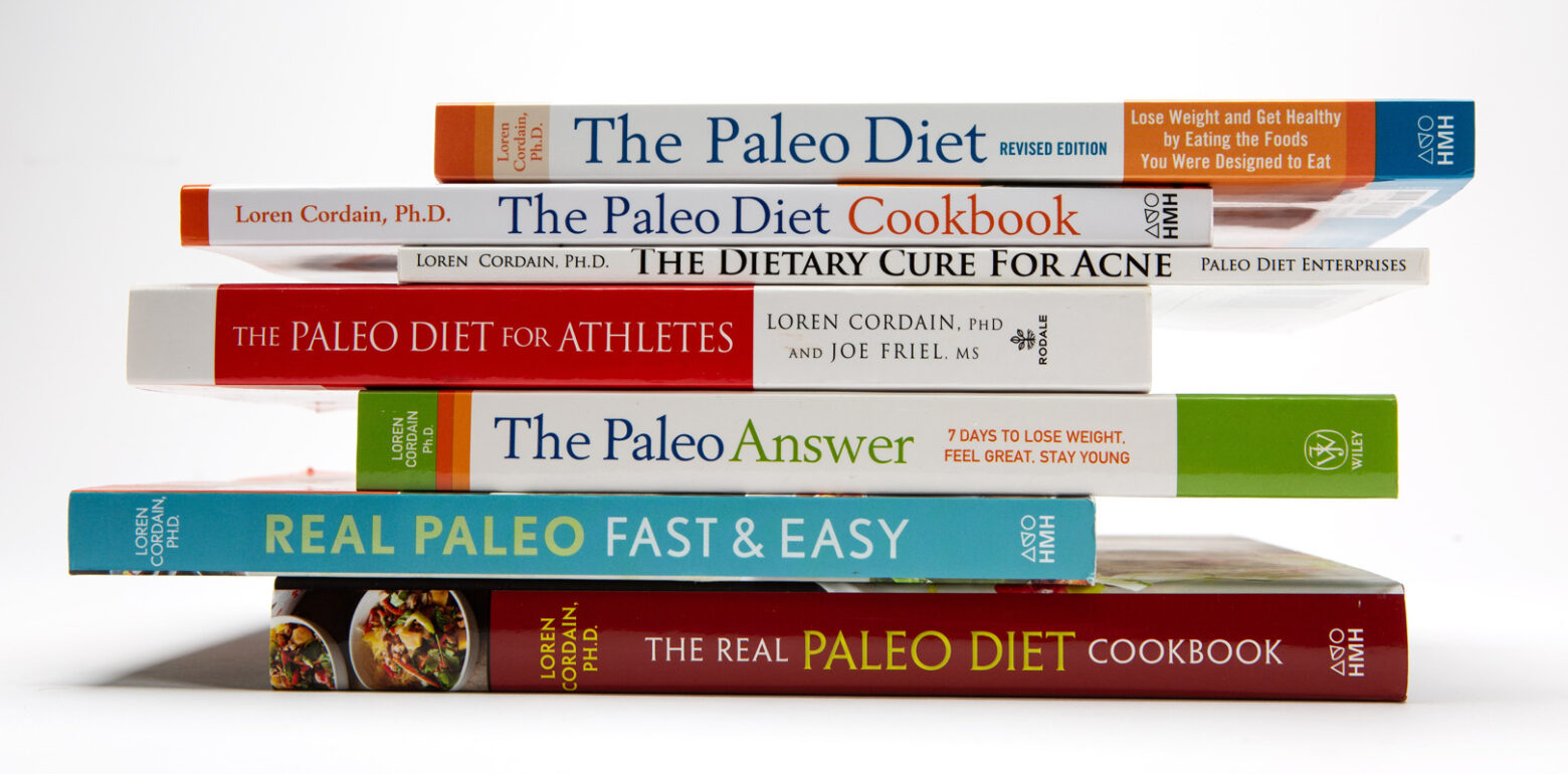 A stack of Paleo Diet books written by Loren Cordain