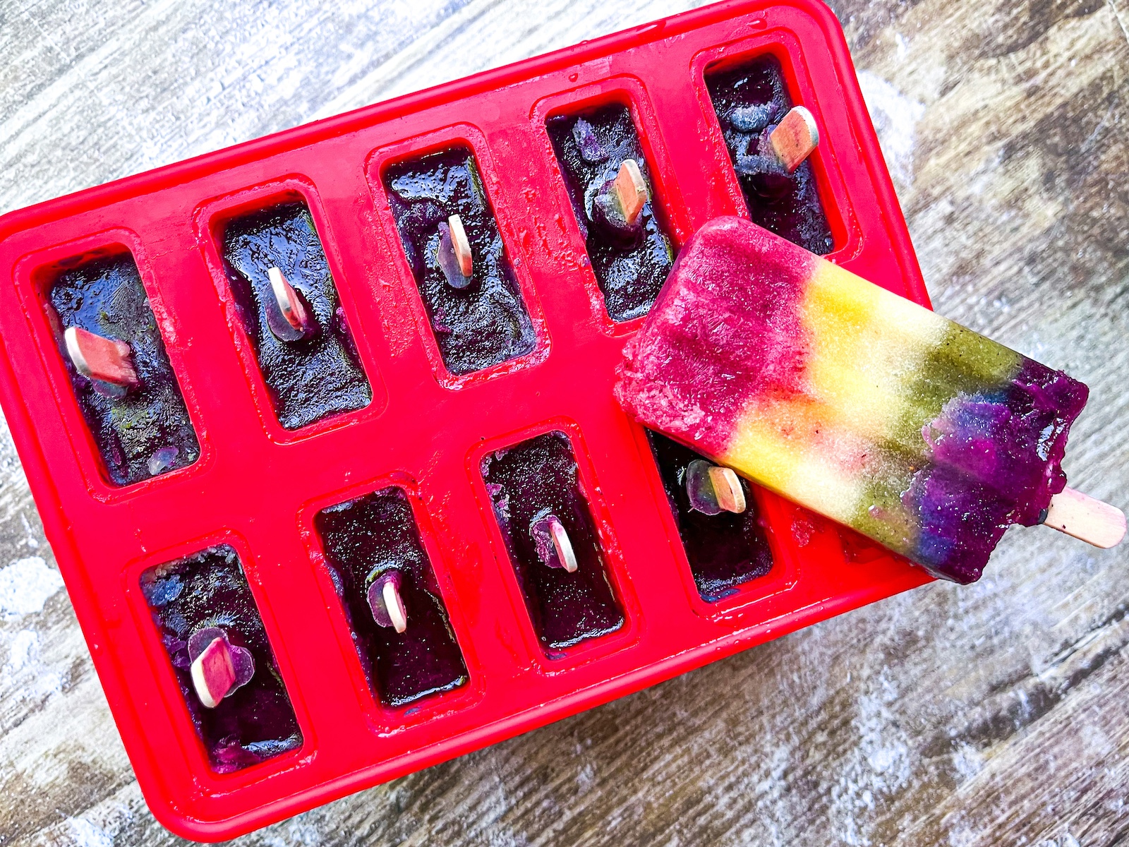 rainbow popsicles in a mold.