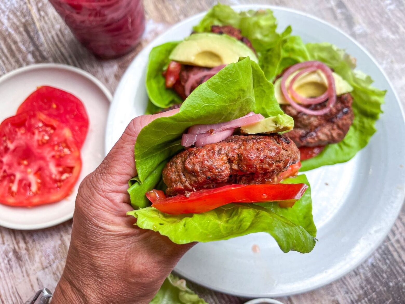 bison burger in hand