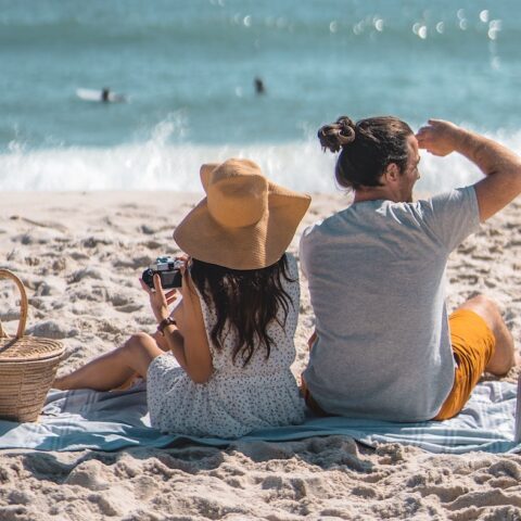 couple having a beach picnic