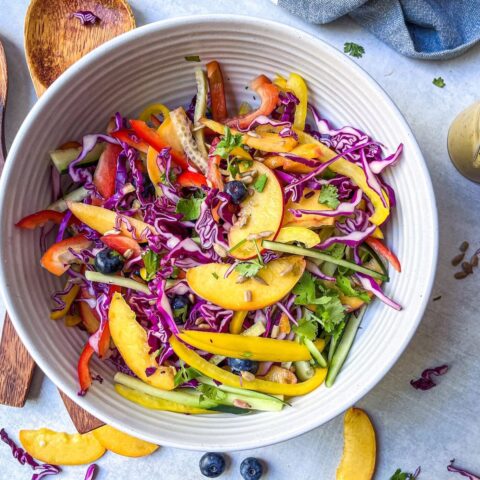 peach & blueberry coleslaw power bowl mixed together