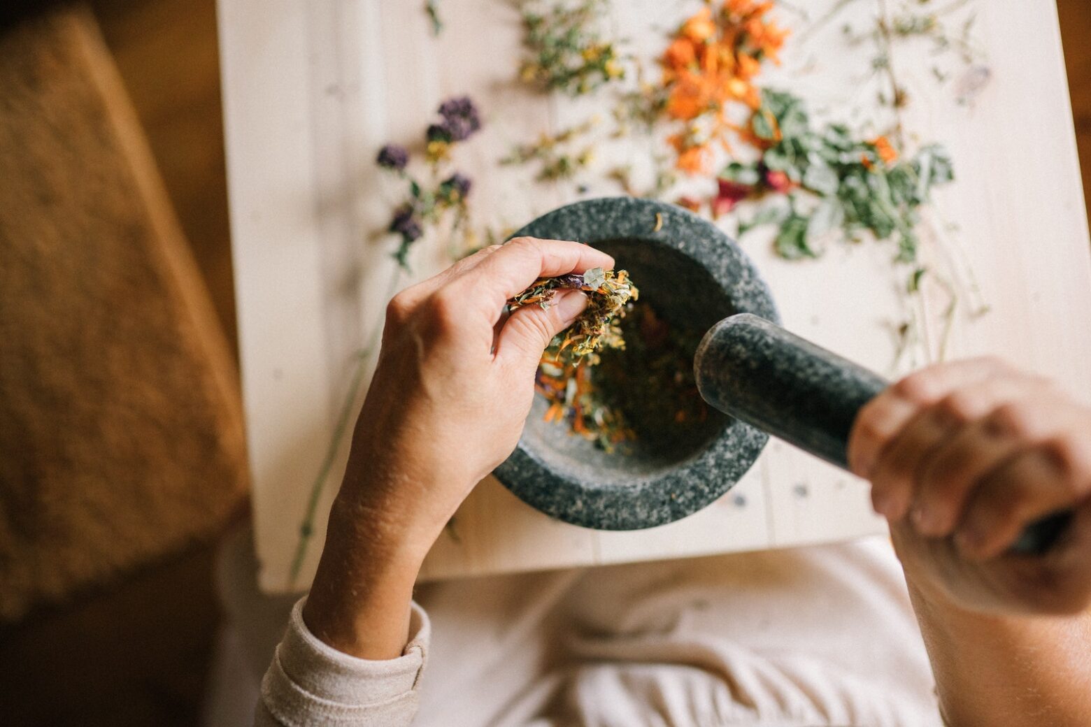 fall spices being grinded in a mortar and pestle