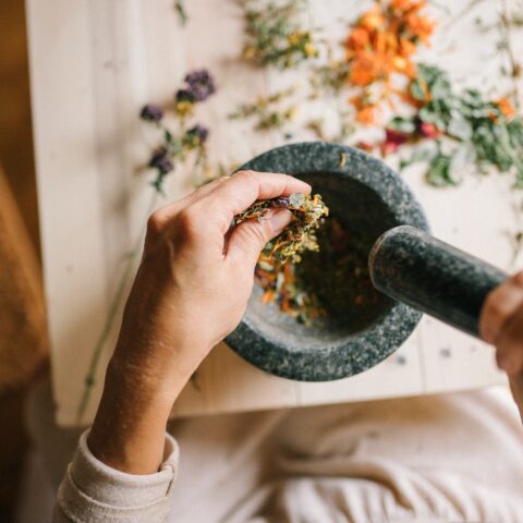 fall spices being grinded in a mortar and pestle