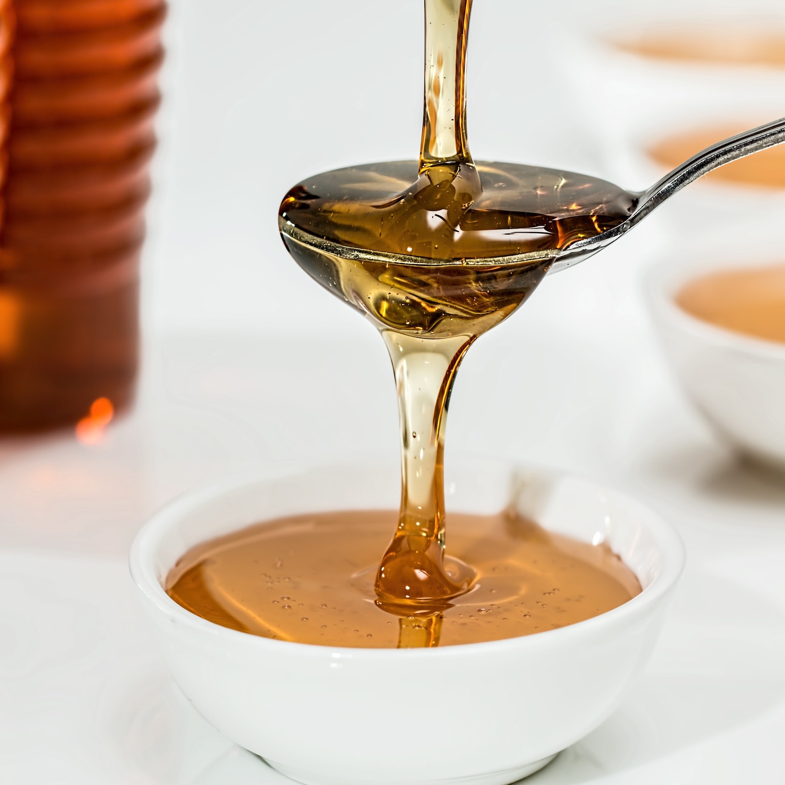 honey dripping onto a spoon