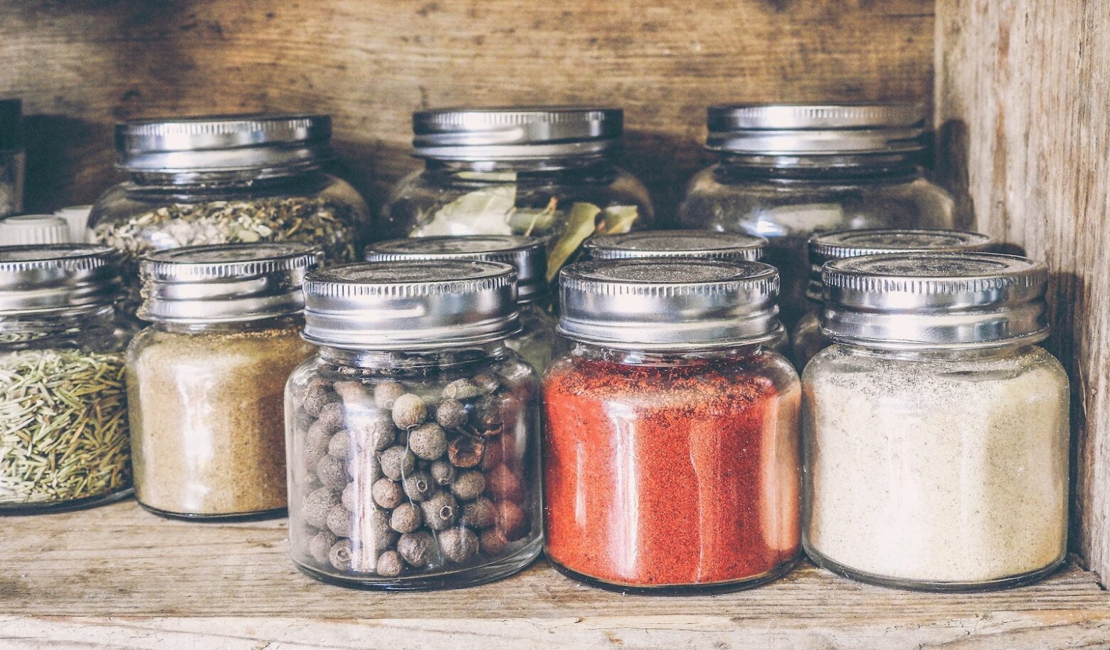 spices in jars on the shelf on a pantry