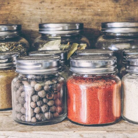 spices in jars on the shelf on a pantry
