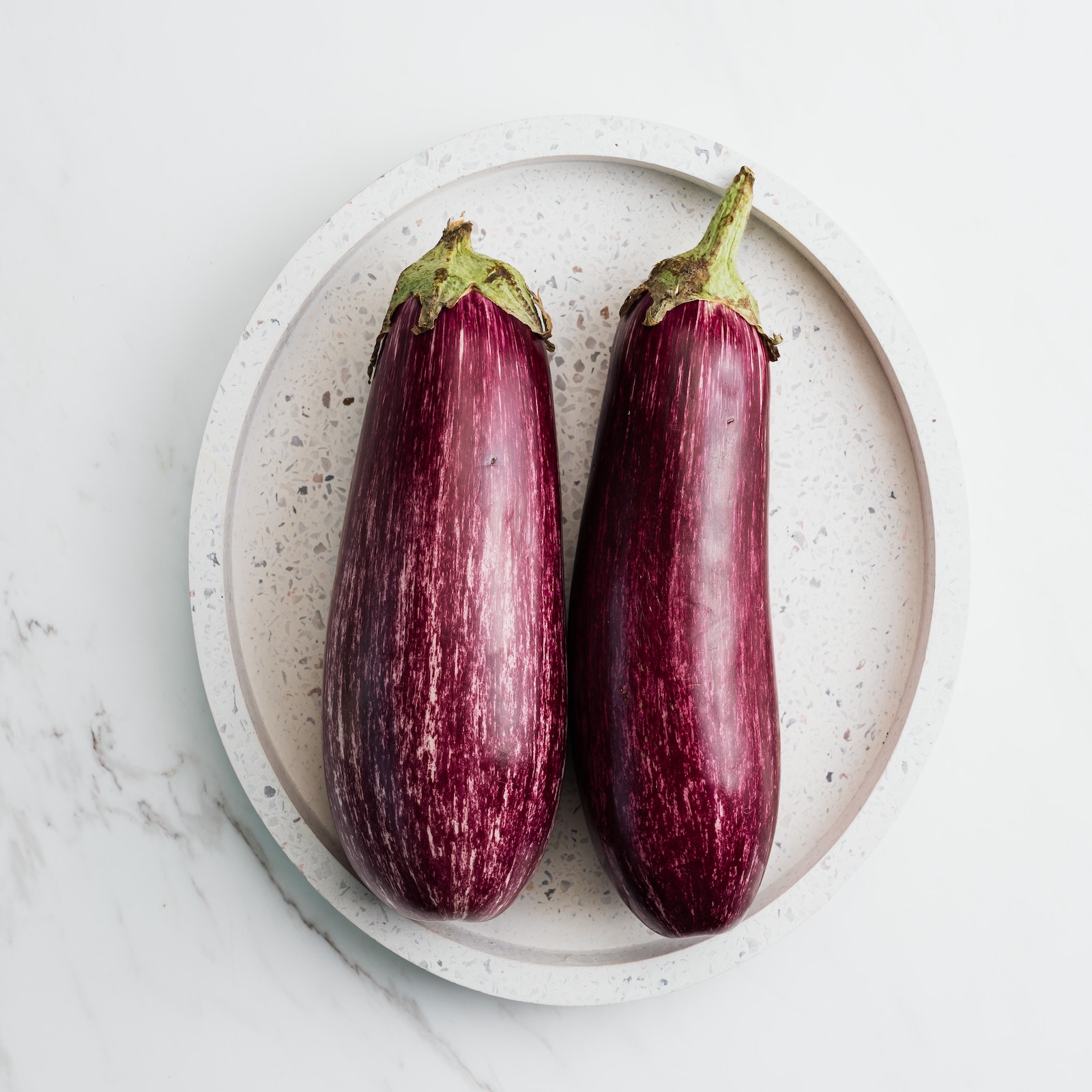 two eggplants on a plate