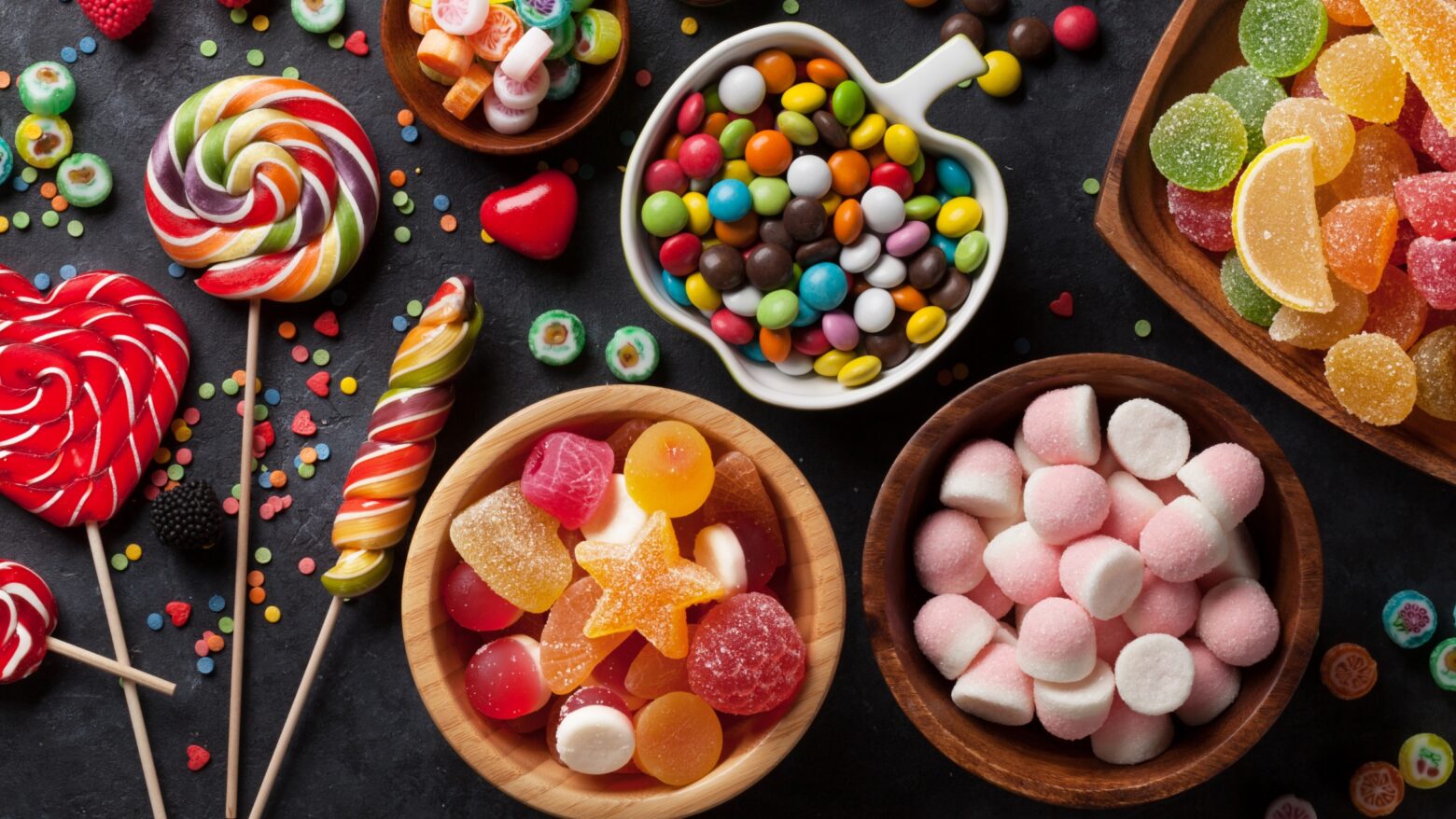 colorful but unhealthy Halloween candies in dishes