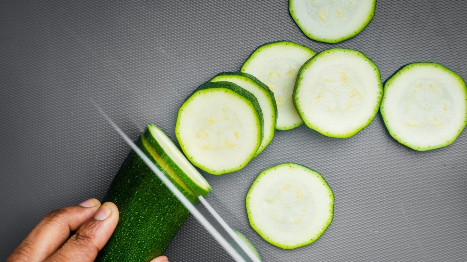 Zucchini being cut into cicles