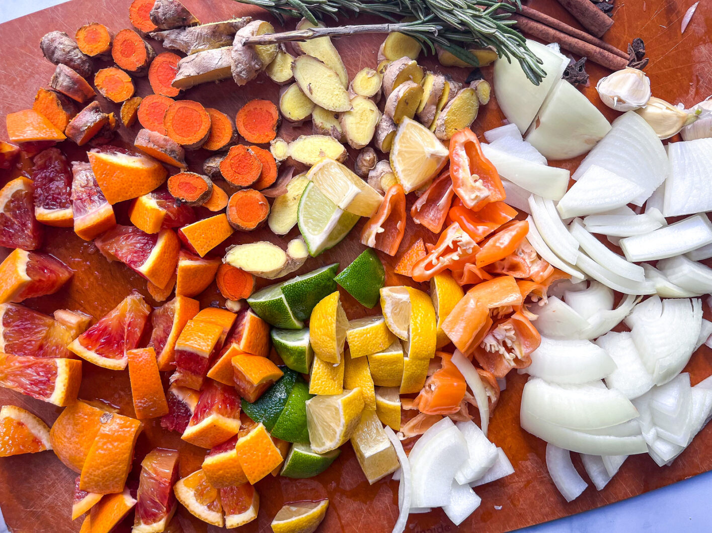 fire cider ingredients chopped up on a cutting board