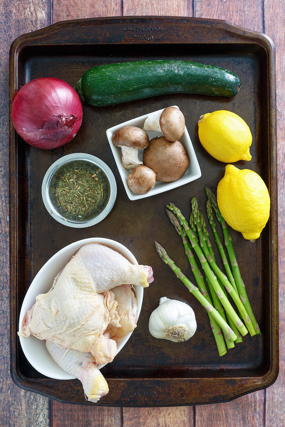 Spring chicken ingredients on a sheet pan
